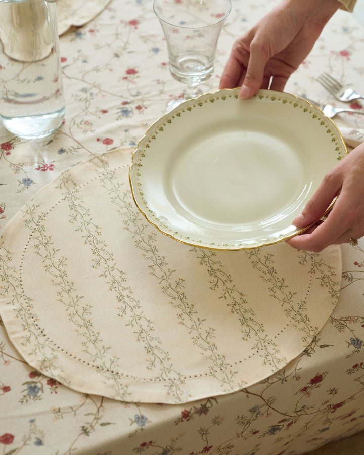 Cream floral stripe placemats with sage green, pale yellow, and tan botanicals for Easter brunch, spring hosting, fall gatherings, and Thanksgiving tables.