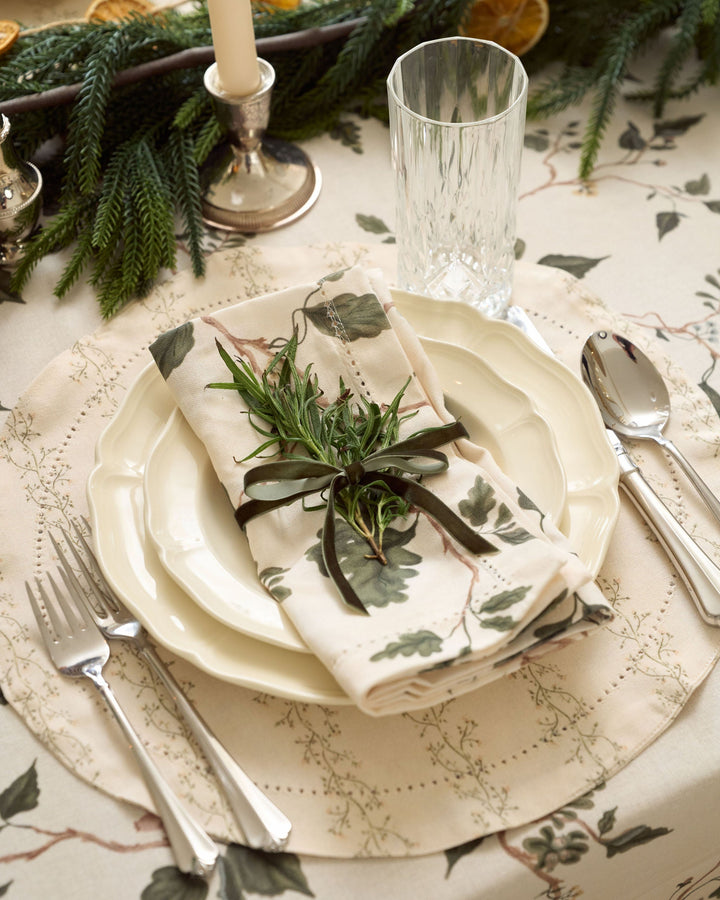 Antique Floral cotton placemats styled with neutral Christmas decor for an elegant holiday table setting with timeless floral details.
