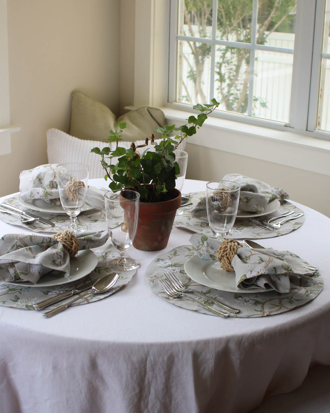 Neutral Camellia floral placemats by Willamere, sold as a set of four round table linens designed for layered place settings, classic dinner parties, spring hosting, garden-inspired tablescapes, and special occasion entertaining.