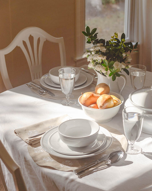 Heirloom, vintage inspired table linens with floral embroidery.