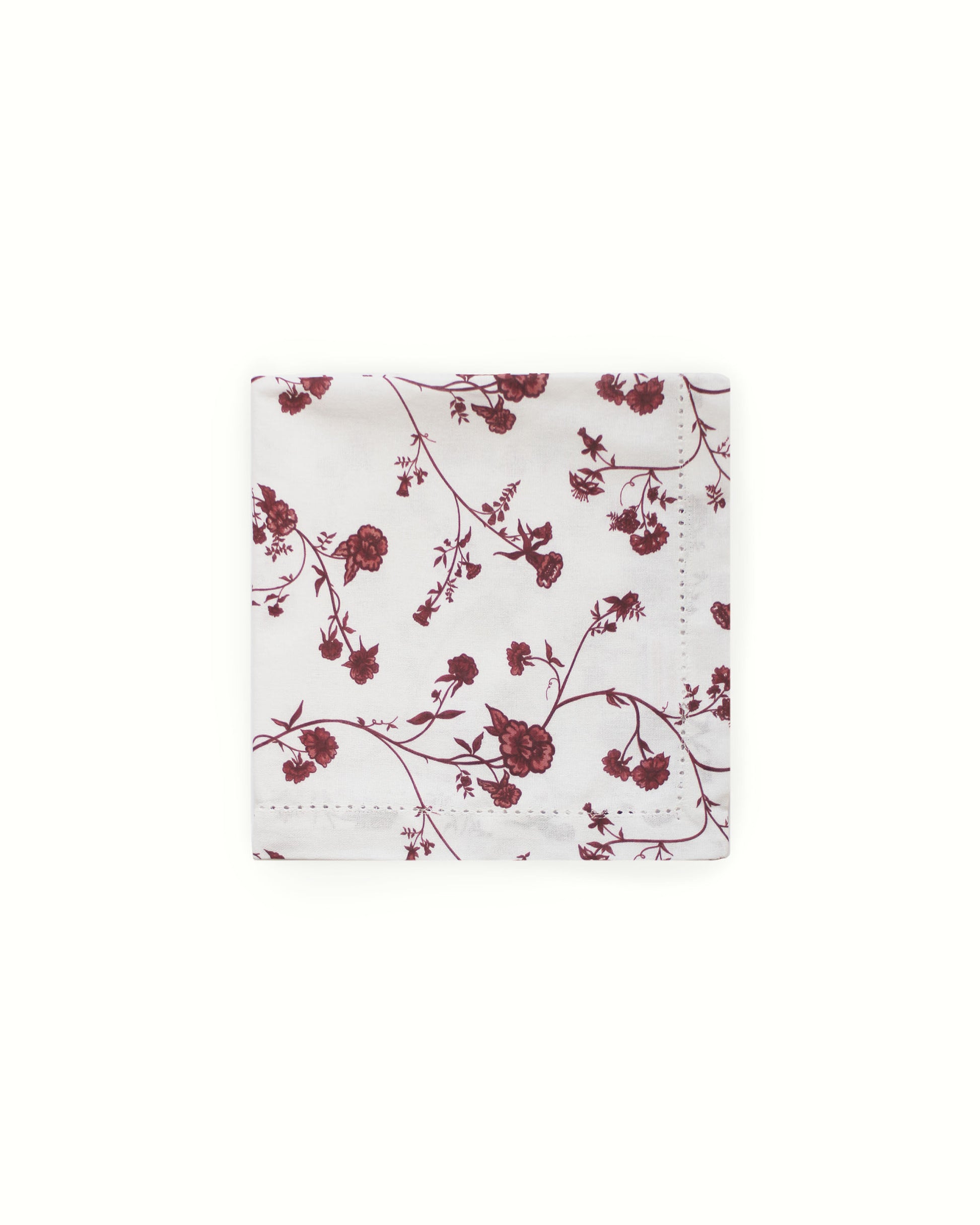 Organic cotton dinner napkins with refined hemstitch and red botanical print for timeless holiday decor.