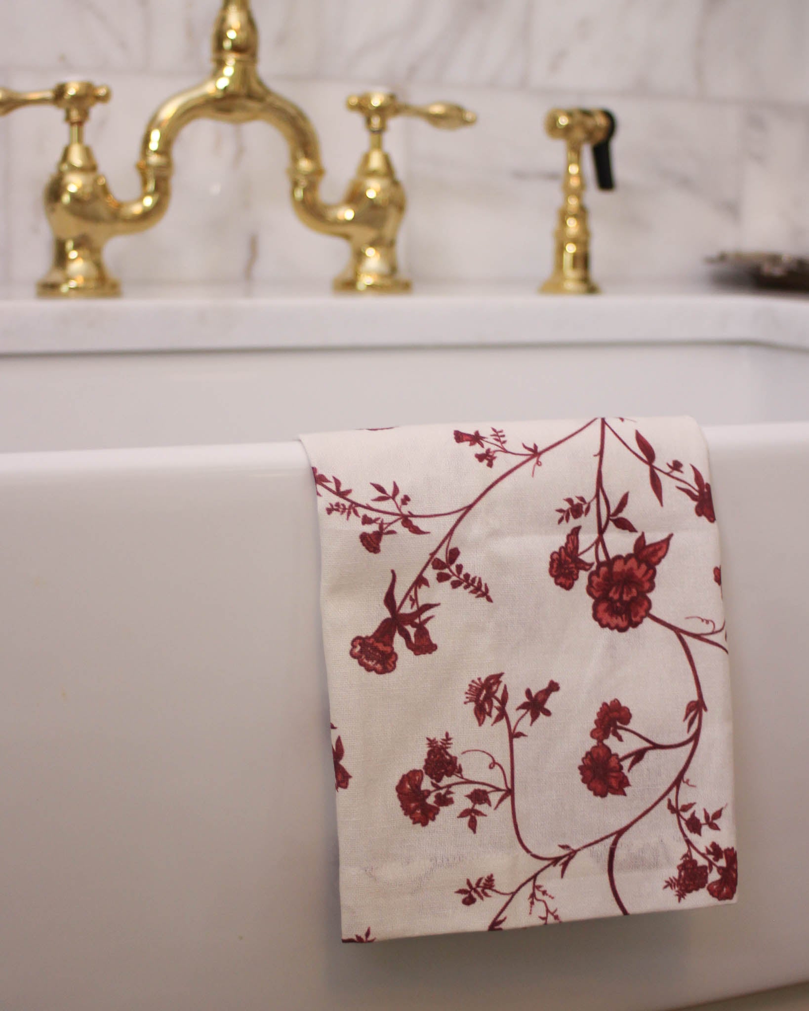 Organic cotton floral towel that adds an inviting, festive touch to any modern holiday kitchen.