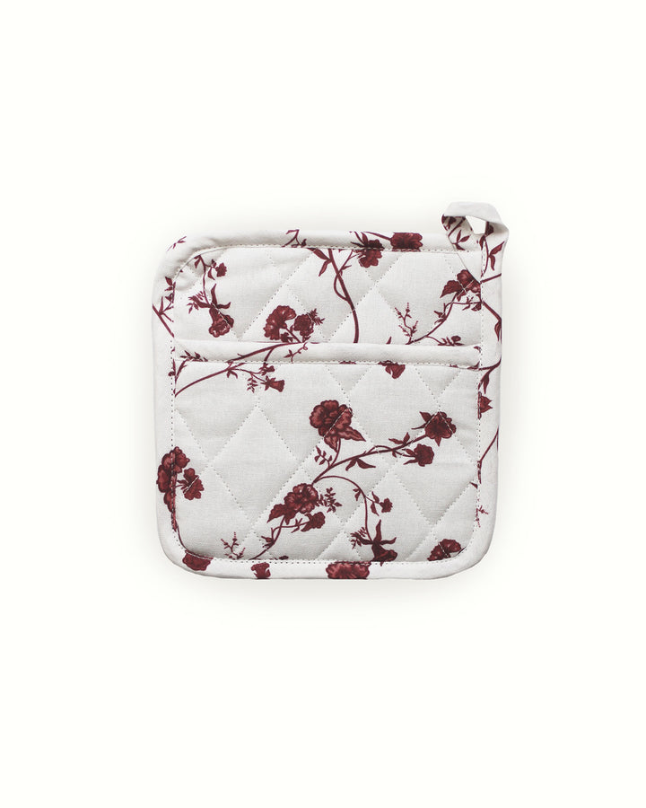 Add elegance and protection to your cottage core kitchen with these red botanical floral potholders. This set of two quilted hot pads is made from durable cotton with a heat-resistant fill, perfect for daily use or festive holiday hosting. Each 8-inch square potholder features intricate diamond stitching for extra strength and a handy hanging loop for easy storage. These stylish red floral hot pads double as trivets, making them a practical and charming gift for any home chef or baker.