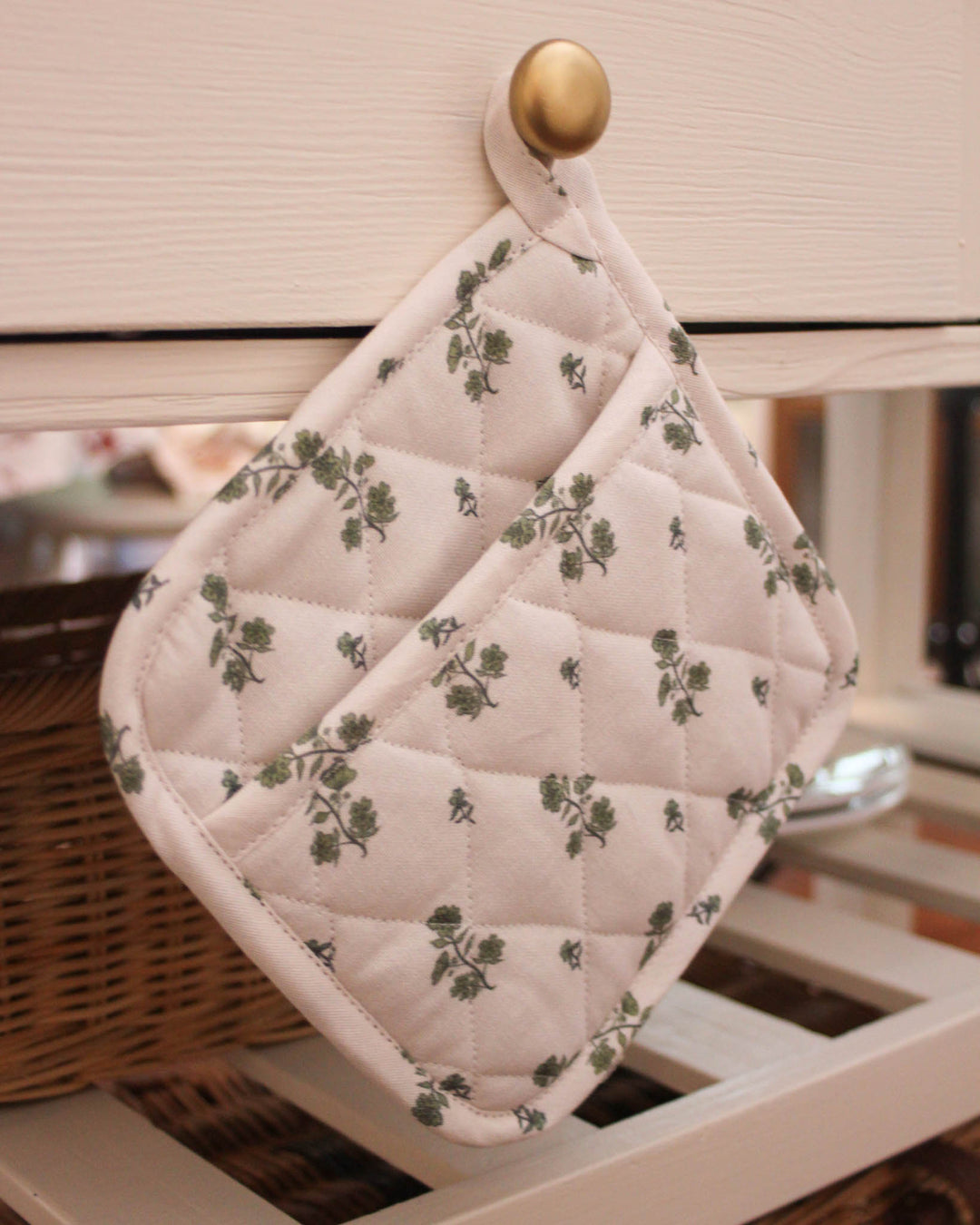 Add a touch of charm to your home with these green floral bouquet print potholders for baking and cooking. This set of 2 features a classic woven potholder design with a 8x8 square shape and hanging loops. Made from premium cotton, these quilted hot pads provide excellent heat protection for hot dishes. They function perfectly as quilted trivets for a Mother's Day brunch. A timeless gift for her or grandma gift, these country kitchen accessories are perfect for Easter baking.