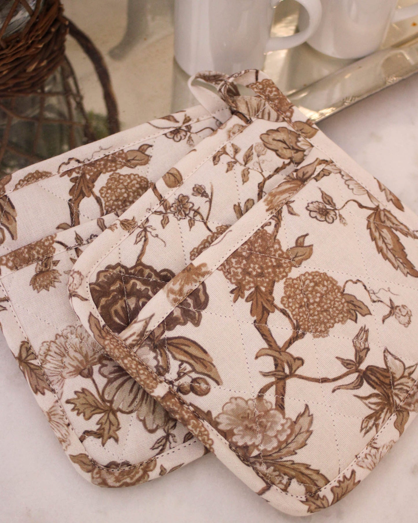 Beautiful floral pot holders in organic cotton. Quilted with heat protection. Thoughtful Mother's Day gift for cooks. Set of 2, ethically made in India.