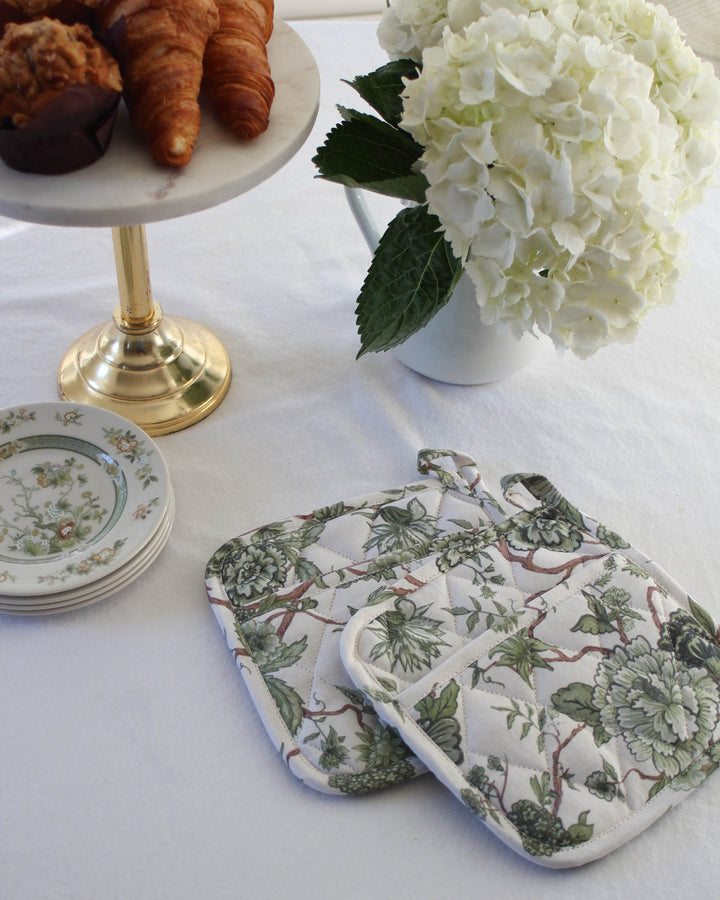 Florence cotton potholders with quilted stitching and heat resistance, designed in Charleston for elegant kitchen use.