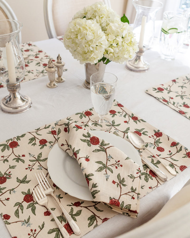 Elevate your table setting with these grand millennial red and green floral placemats. The intricate botanical design is both vintage-inspired and modern, making them perfect for a stylish spring brunch. These 14.5 inch by 20 inch cotton placemats offer a high-quality feel for your daily meals or special events. As reusable and washable placemats, they are a practical choice for busy homes. Pair these rectangle placemats with white plates to make the red floral print pop.