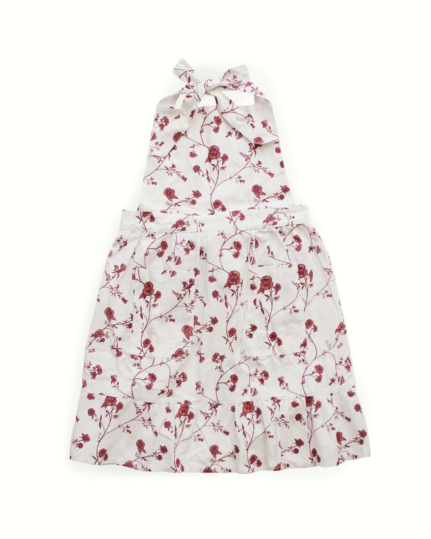 Sustainable organic cotton apron with floral print, perfect for festive gatherings and gifting.