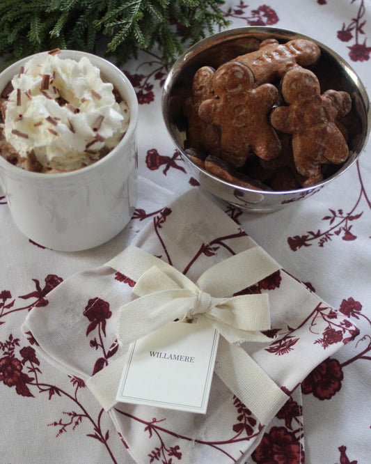Set of four Garden Vine Cocktail Napkins with hand-drawn red florals on soft organic cotton.