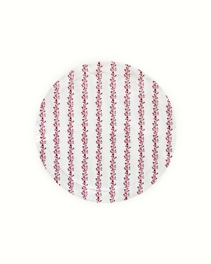 Achieve a perfectly layered look by pairing these red floral stripe round placemats with crisp white napkins. The vibrant red botanical print and striped background offer a rich visual story for your Easter table decor. These reusable cotton placemats are accented with a traditional hemstitched finish, providing an artisan feel to your collection. Perfect for a garden wedding or summer brunch, these washable placemats are a timeless choice for anyone pursuing a French country style.