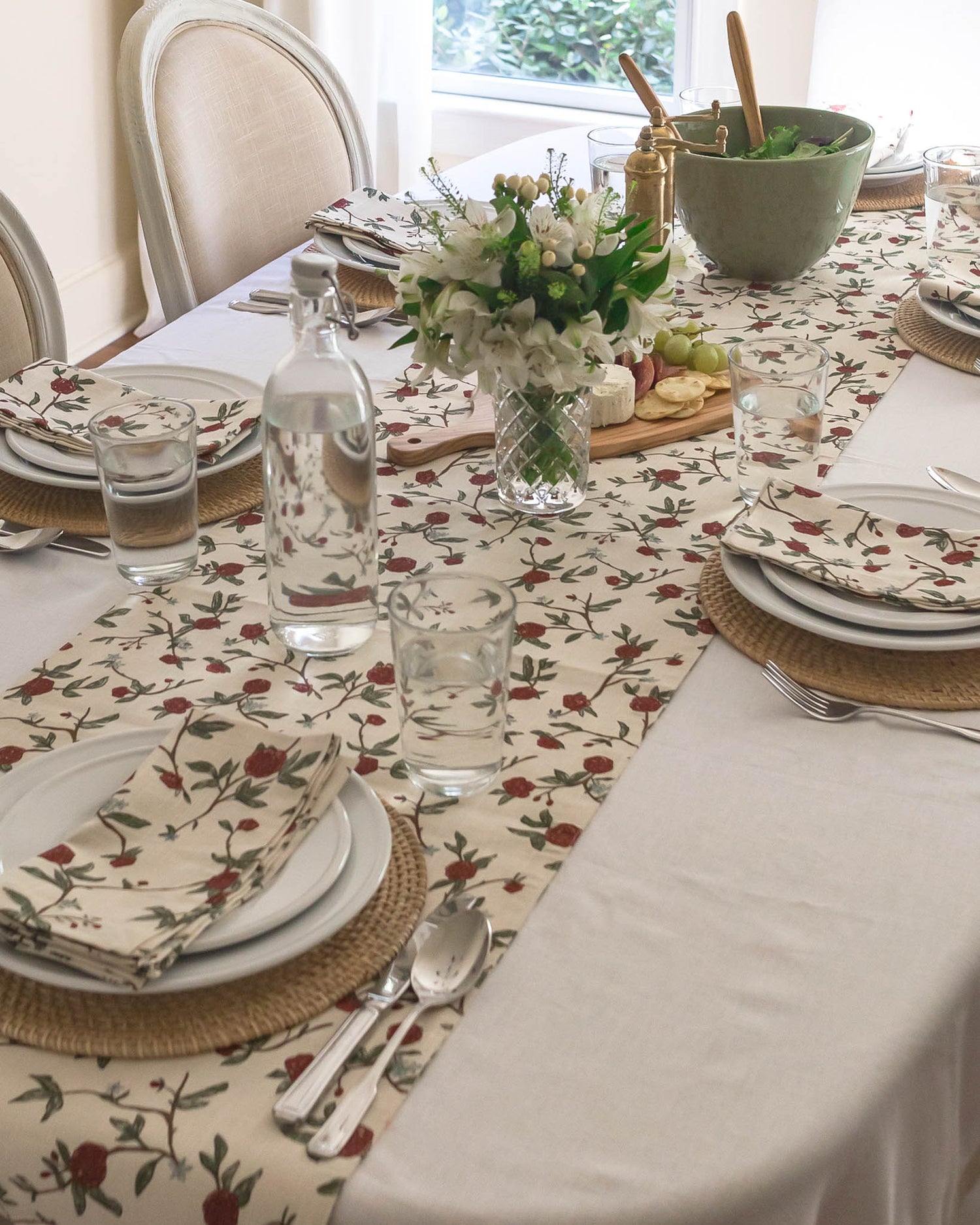 Beautiful William Morris-inspired floral table runner, featuring a hand-drawn design of red flowers, lush green leaves, and subtle blue accents perfect for Christmas table.