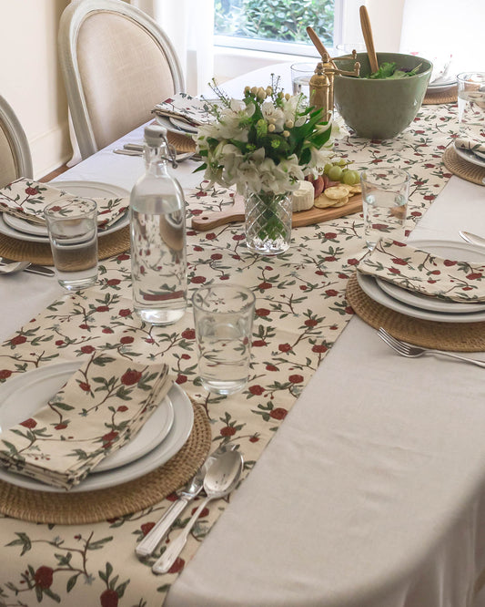 Beautiful William Morris-inspired floral table runner, featuring a hand-drawn design of red flowers, lush green leaves, and subtle blue accents perfect for Christmas table.