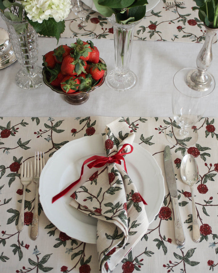 Brighten your home with these red and green cotton floral placemats. Featuring a cheerful botanical print of red roses and green leaves on a soft white background, these rectangle placemats are perfect for a spring garden party. Measuring 14.5 x 20 inches, these reusable placemats provide plenty of space for your dinnerware. These washable placemats offer a fresh look for your table, making them a great choice for outdoor brunch or a colorful Easter table decor setup.