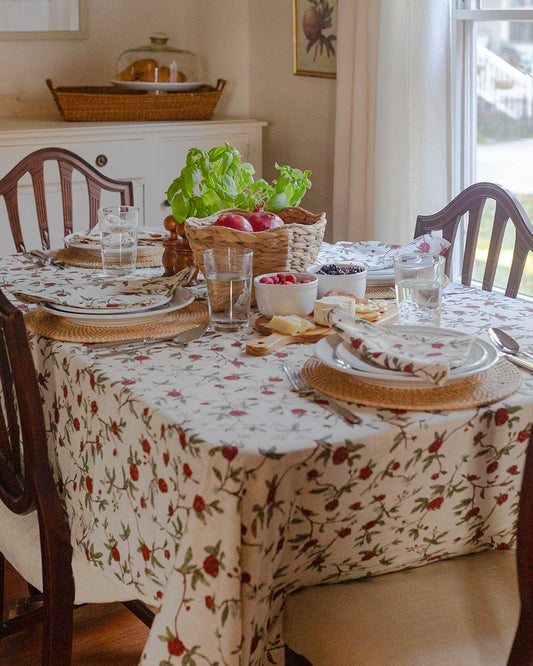 Floral tablecloth in William Morris inspired red and green botanical print for spring hosting decor, featuring a delightful design of charming red flowers and lush green leaves with a hint of blue that compliments your china, all hand-drawn with love. 