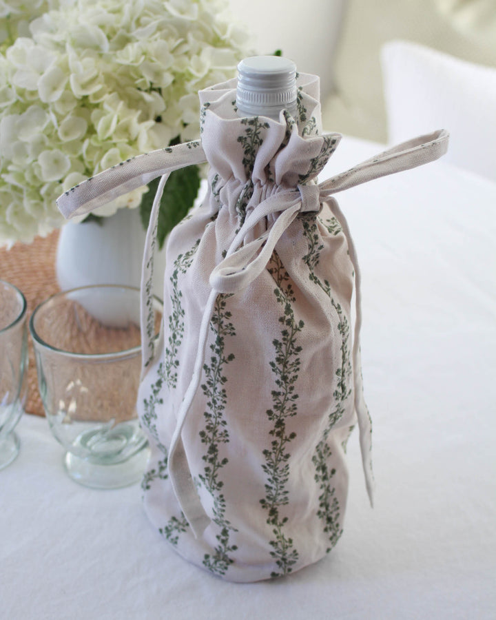 Green stripe floral wine bag in cotton with drawstring closure, perfect for hostess and holiday gifting.