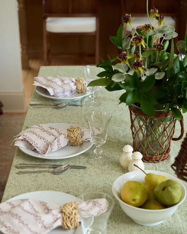 Elegant Thanksgiving tablecloth in brown, sage green, and cream with a botanical floral design inspired by classic English countryside linens.