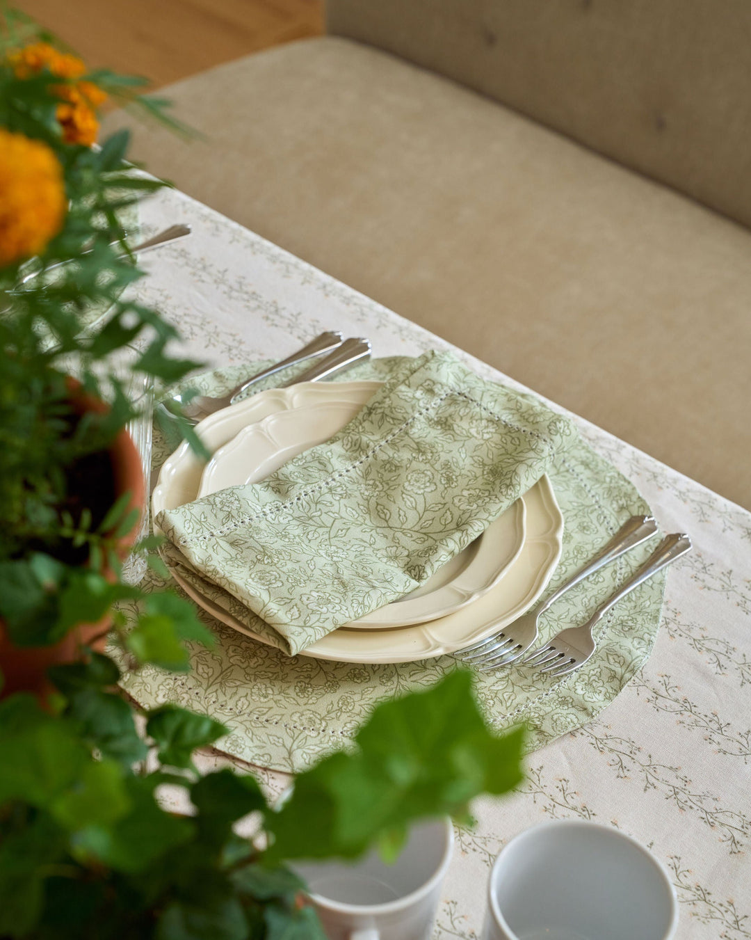 Sage green floral dinner napkins inspired by English countryside and cottage-style table linens for fall gatherings and year-round entertaining.