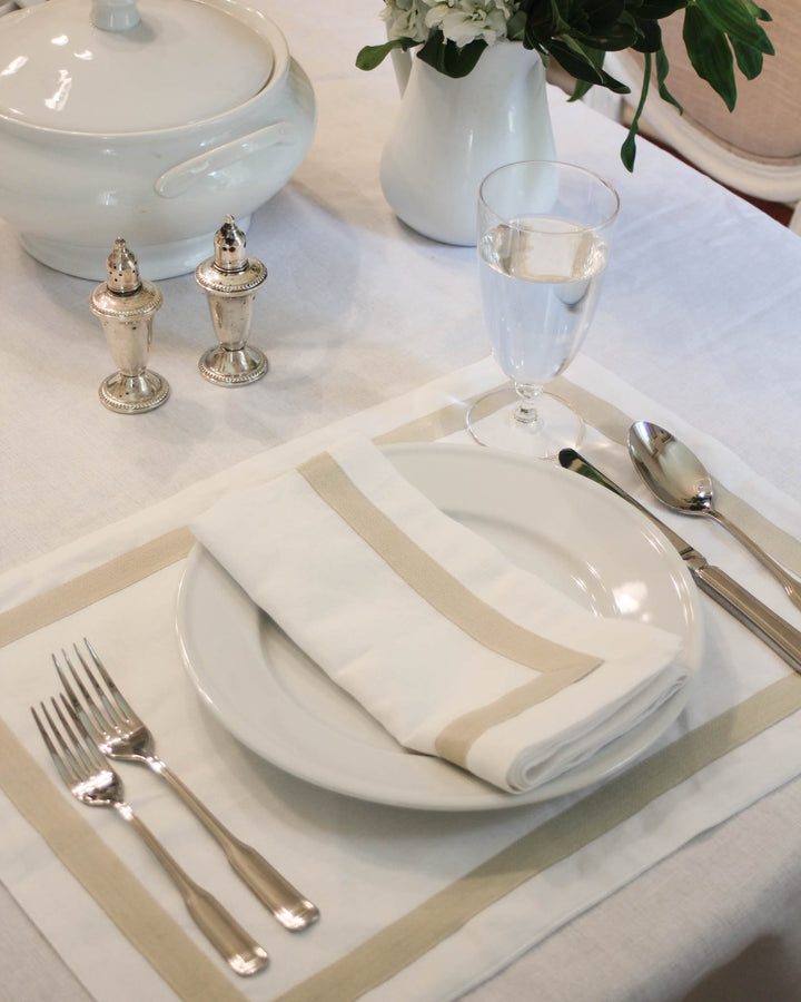 Willa placemats made from an organic cotton and linen blend, finished with a simple border trim for a clean, elegant aesthetic. This set of four placemats elevates both casual and formal tables, making them perfect for Easter gatherings, bridal showers, and Mother’s Day hosting. Designed to feel like a lasting keepsake, they complement grand millennial and French country tablescapes.