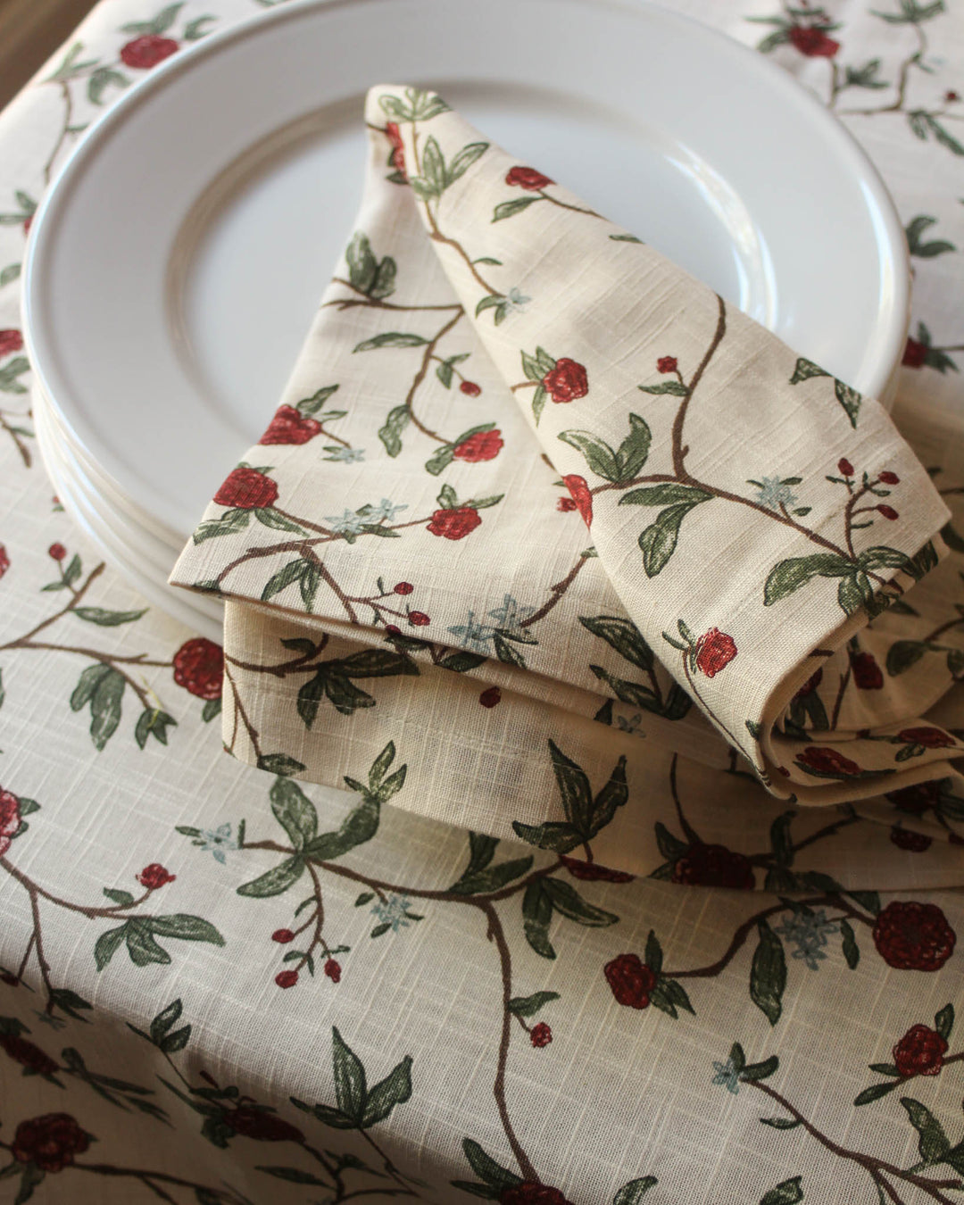 Make Mom feel truly celebrated with a table set with these red and green floral napkins. This set of 4 premium cotton linens is a must-have for a Mother’s Day brunch, offering a cheerful yet sophisticated atmosphere. The intricate flower and vine pattern coordinates perfectly with fresh spring bouquets and embroidered table runners. Ideal for a sister, friend, or mom who enjoys hosting, these 20x20 napkins turn any meal into a special occasion, celebrating the bright colors of the season.