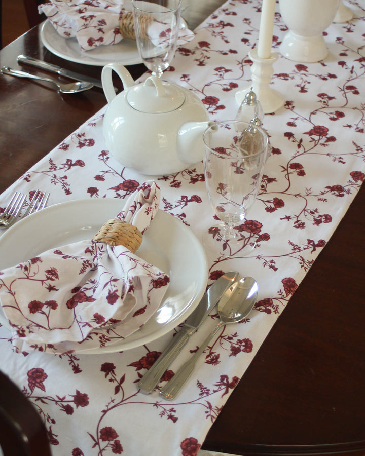 The ideal Mother’s Day gift for mom or grandma who loves traditional floral prints. This red botanical cotton table runner showcases a charming hand-drawn pattern of roses and greenery. Available in 104" and 120" sizes, it’s perfect for a Mother’s Day brunch or high-tea party. Made from soft, 100% organic cotton that becomes more beautiful with every wash. A thoughtful, elegant gift that brings the timeless beauty of a red rose garden indoors for a sophisticated host.
