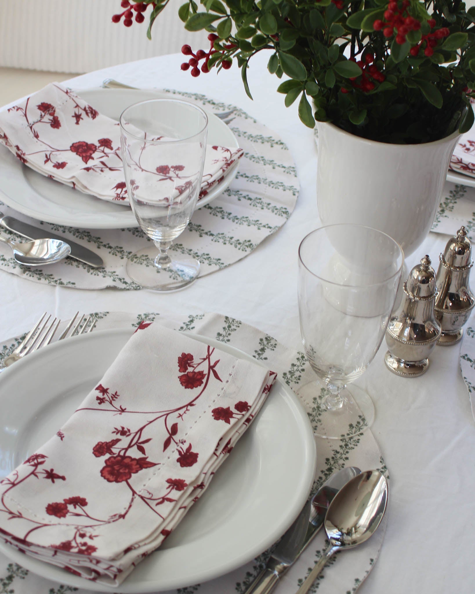 Sustainable red floral cloth napkins that elevate Christmas dining and festive hosting.
