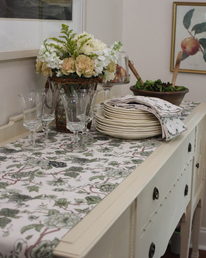 Elevate your Spring table with the Florence Runner. Premium cotton featuring a hand-drawn green botanical print. Ideal for weddings and brunches. 