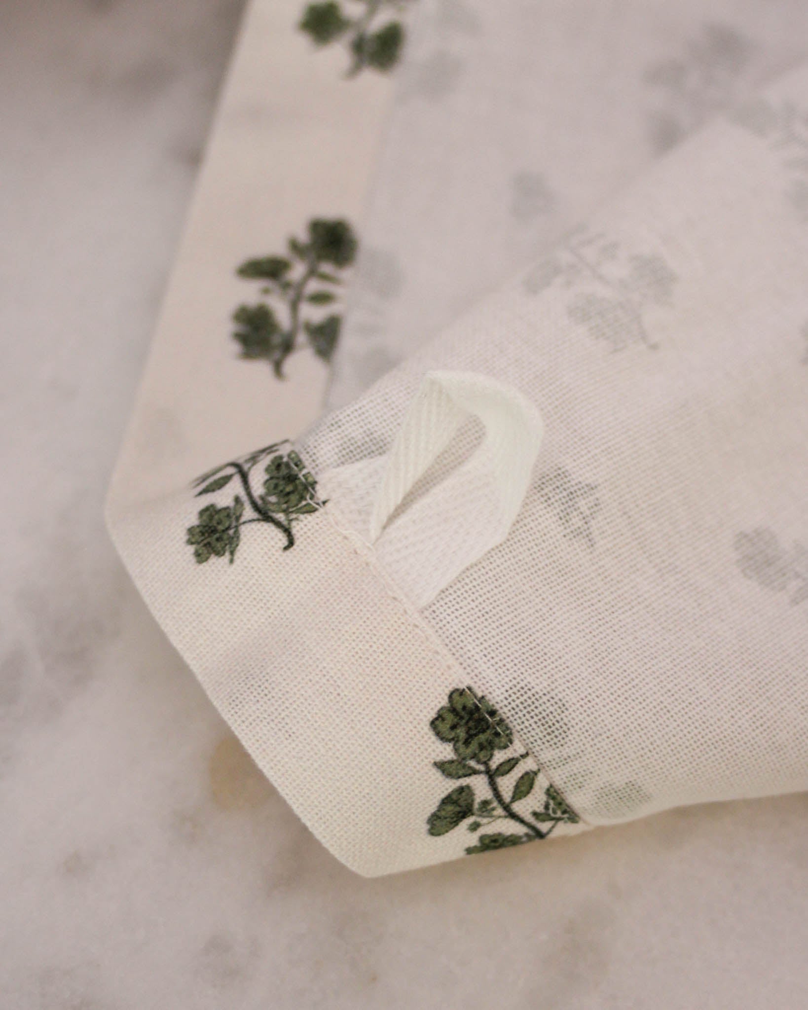 Hand-drawn floral tea towel in organic cotton. Perfect holiday hostess gift for Thanksgiving or Christmas. Hanging loop, absorbent, chemical-free dyes. Made ethically.