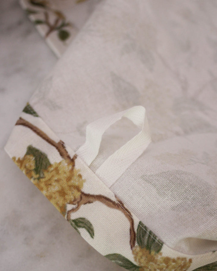 Hand-drawn marigold floral print tea towel with loop