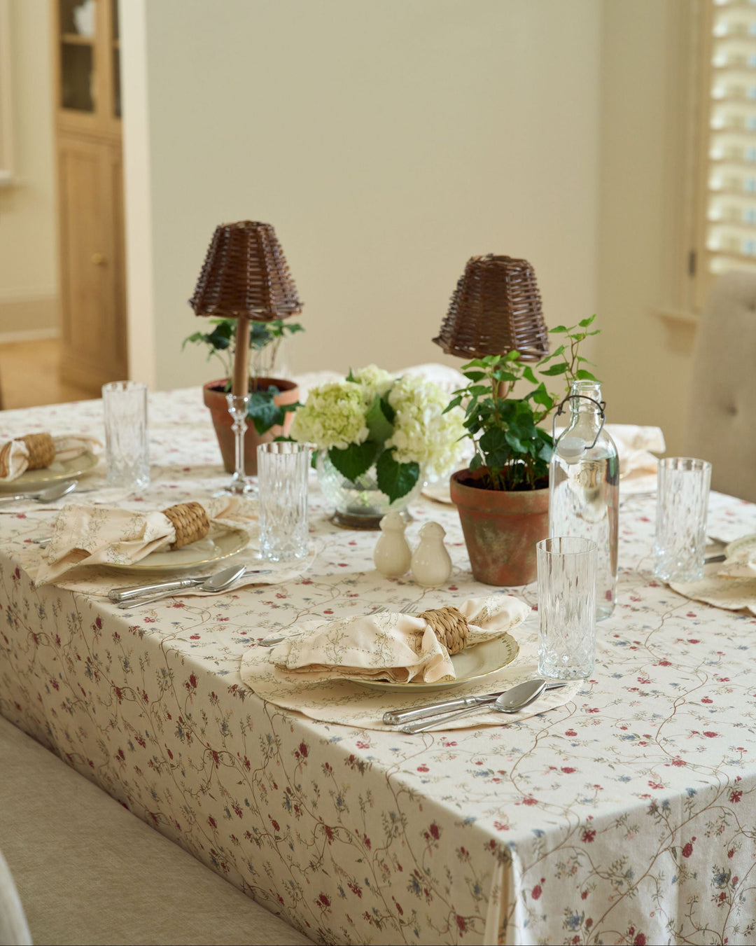 Antique Floral tablecloth in cream, moss green, terracotta, dusty blue, and soft pink, styled for a neutral Thanksgiving table.