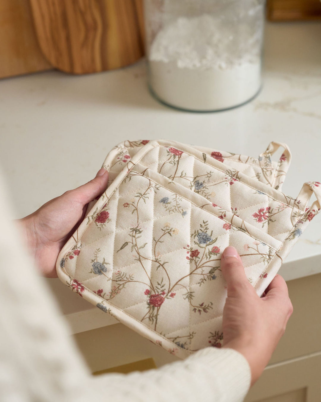 Antique-inspired floral cotton pot holders designed to protect hands and surfaces while cooking, baking, serving hot dishes, preparing homemade recipes, hosting dinner parties, celebrating Thanksgiving and Christmas, and gifting to bakers, hostesses, newlyweds, and new homeowners.
