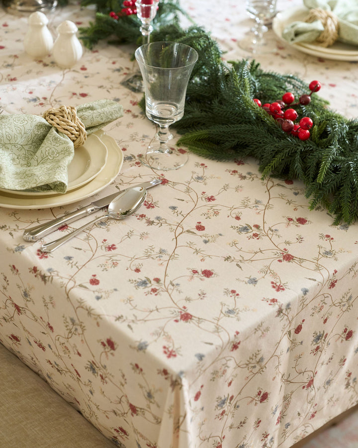Willamere hand-drawn botanical tablecloth styled with classic Christmas decorations for an elegant and understated holiday dining table.