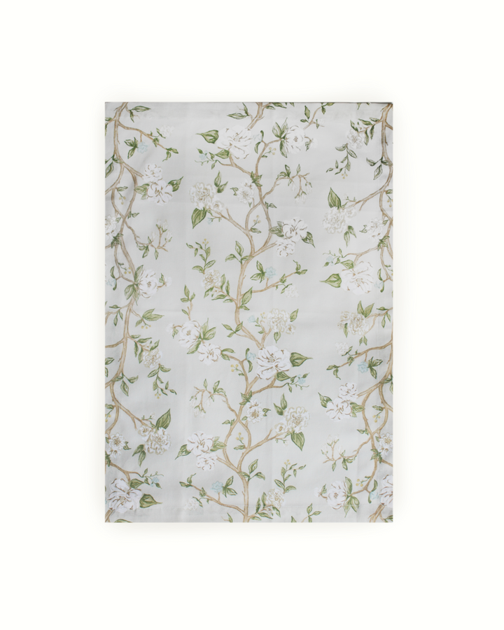 Camellia tea towel with hand-drawn floral design, perfect for lining bread baskets and adding charm to the kitchen.