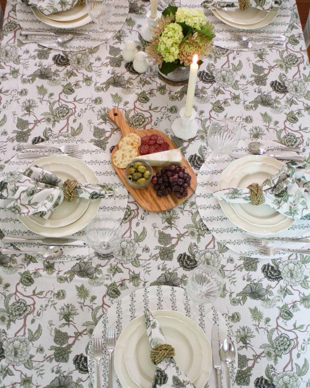 Easter Tablecloth in a blooming Chinoiserie Print. This Rectangle Tablecloth (66x104 and 66x120) features intricate green botanical flowers. Perfect for Grand Millennial Decor lovers, this Cotton Tablecloth adds French Country charm to your dining room. Whether used as a Spring Tablecloth for daily use or a special Rehearsal Dinner, its handcrafted quality shines. A perfect gift for mom or grandmom, this Floral Tablecloth fits long tables with a beautiful drape.