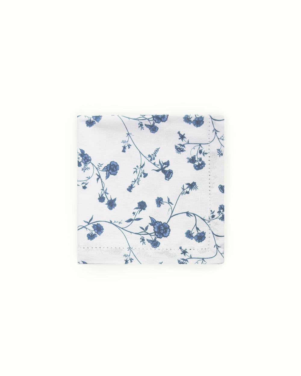 Blue floral patterned cotton napkins on a white background