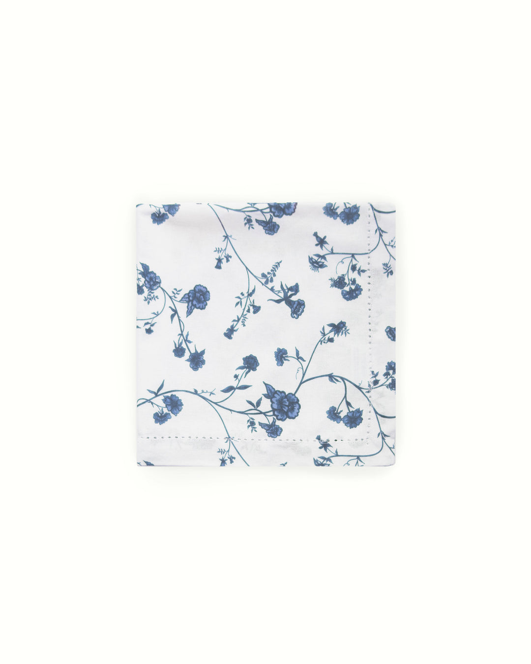 Blue floral patterned cotton napkins on a white background