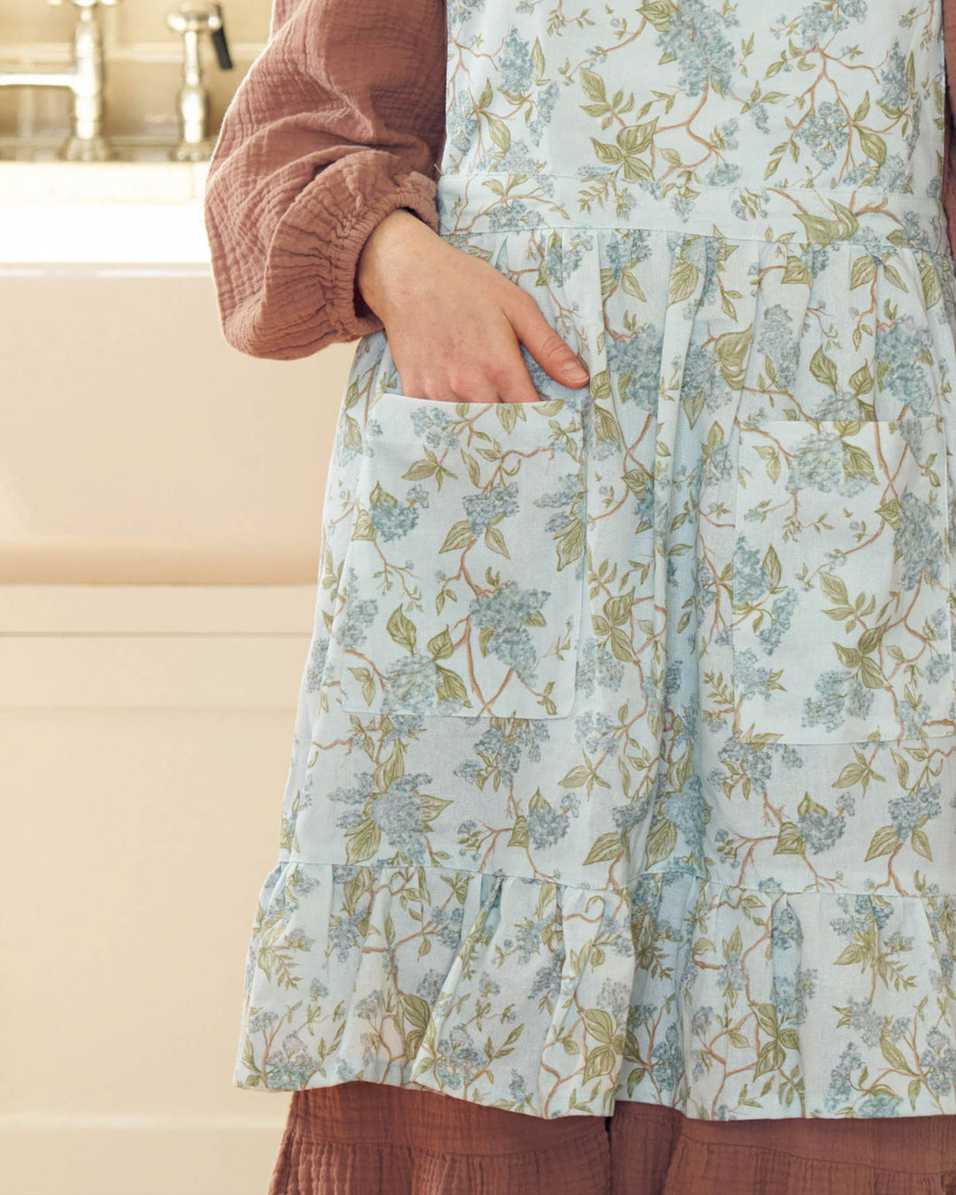 Cotton apron with delicate blue watercolor hydrangea florals in a timeless, heirloom-inspired style