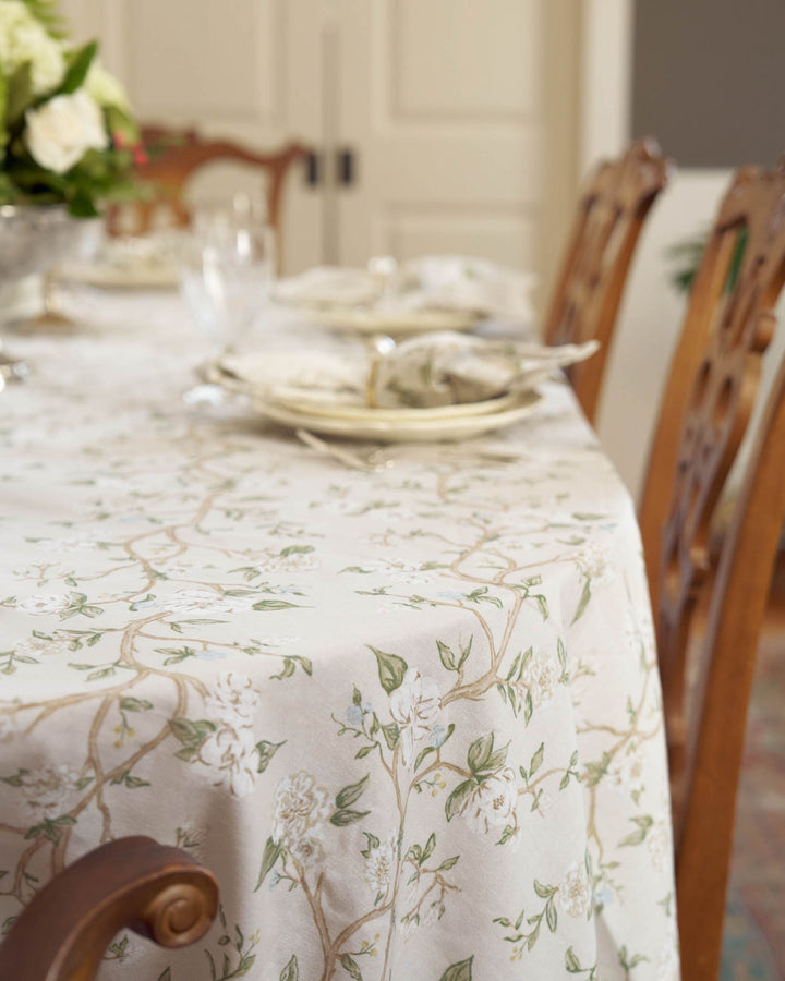 Wedding table styled with a neutral camellia cotton tablecloth in an heirloom-inspired design.