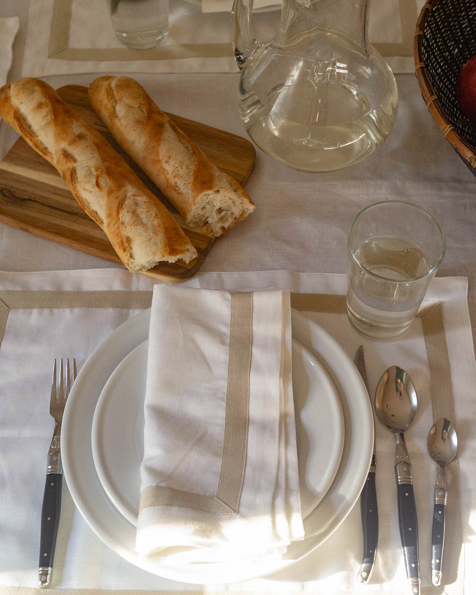 Elegant white table setting perfect for Thanksgiving tablecapes, autumn kitchen decor, and more.