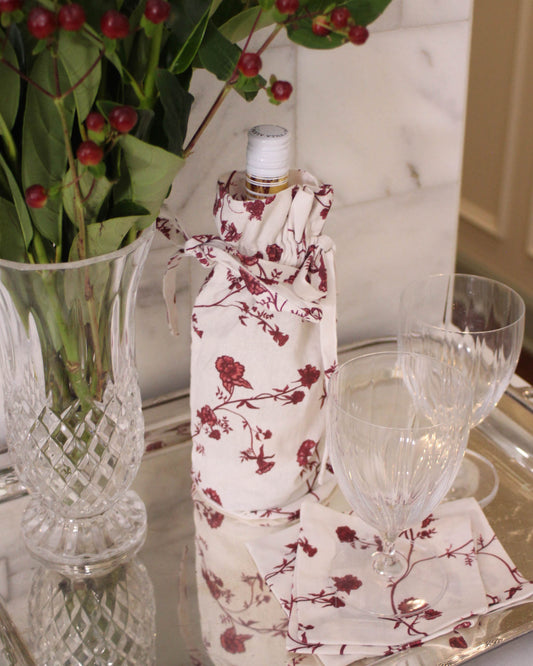 Festive floral wine bag with drawstring closure, perfect for wrapping a favorite bottle.