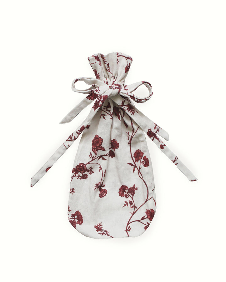 Floral cotton wine bag featuring a simple drawstring tie, crafted sustainably in India.