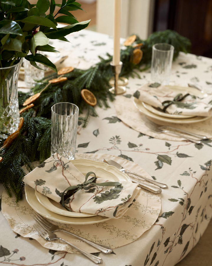 Arbor botanical cloth napkins with green oak leaves and neutral florals for Christmas tables, winter hosting, and year-round dining.