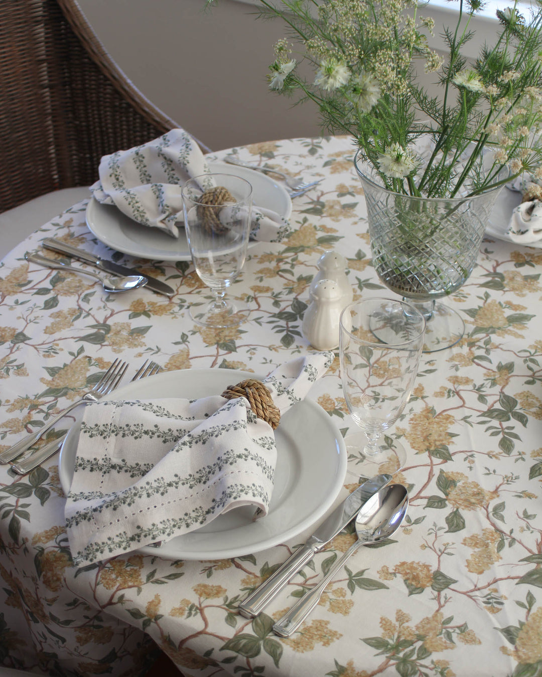 Spring yellow floral cotton tablecloth styled for spring entertaining and seasonal hosting.