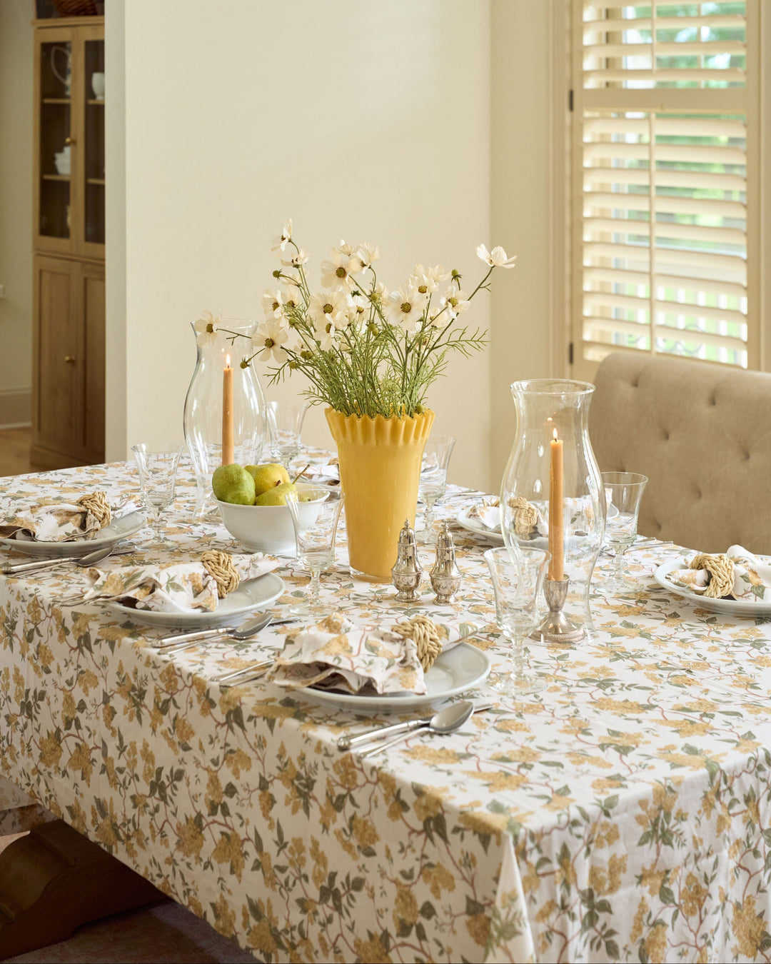 Yellow botanical floral tablecloth in cotton, bringing warmth and pattern to fall tablescapes, seasonal gatherings, Thanksgiving hosting, and classic dining rooms.