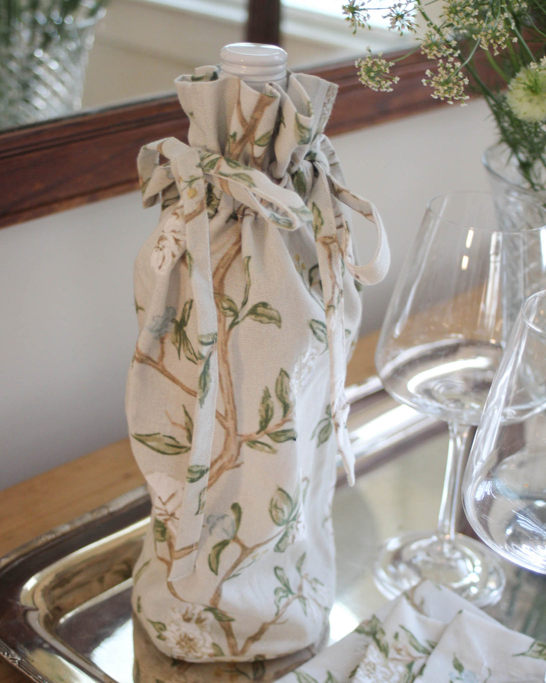 Cotton wine gift bag with drawstring closure, perfect for wrapping wine and small-batch treats for anniversary, weddings, bridal showers.
