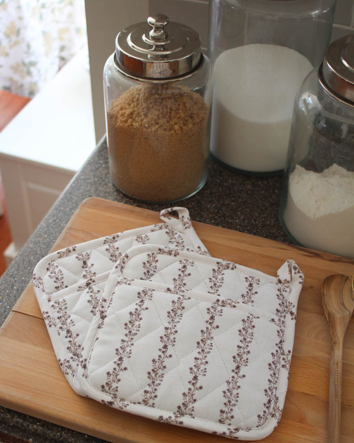 Floral stripe cotton potholders set of 2, designed for handling hot dishes during holiday meals and everyday kitchen use.