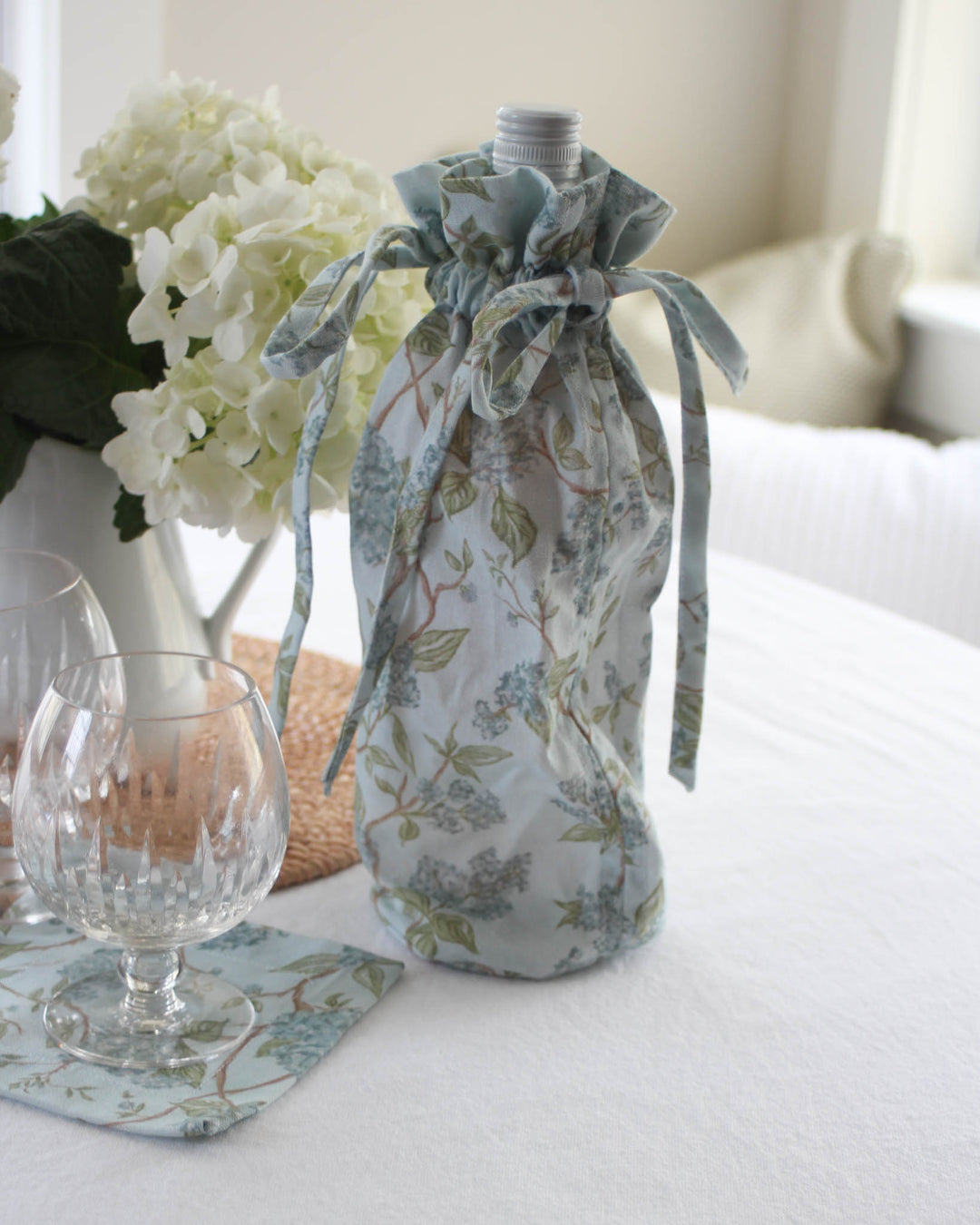 Hyacinth blue floral wine bag in cotton with drawstring closure, perfect for bridal shower and wedding gifting.