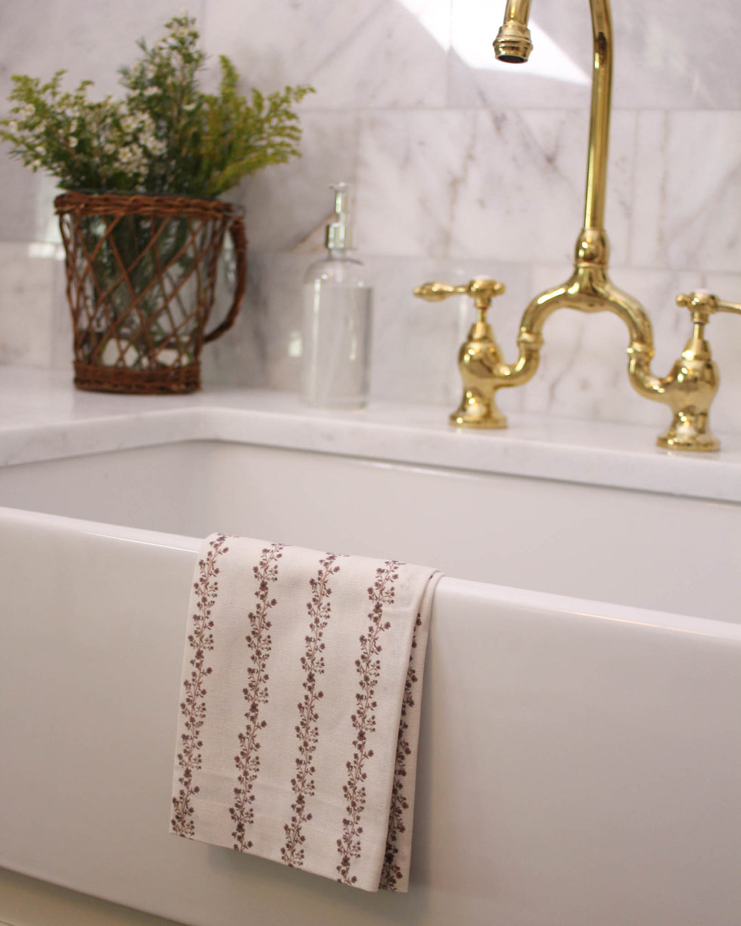Hand-drawn brown floral tea towel with a classic striped design, a decorative kitchen towel for Thanksgiving hosting, fall gatherings, and gifting.