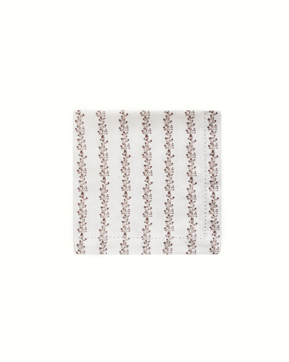 Create a vintage garden look with these brown stripe floral print cotton napkins. Sold in a set of 4, the 20" x 20" dimensions allow for elegant draping and layering on your table. The hand-drawn brown floral illustrations layered over thin stripes add warmth to any Easter or Mother's Day brunch. These napkins are not just decor; they hold space for memories made around the table. An ideal gift for a hostess or a housewarming present, they work perfectly for formal dinner parties and casual meals.