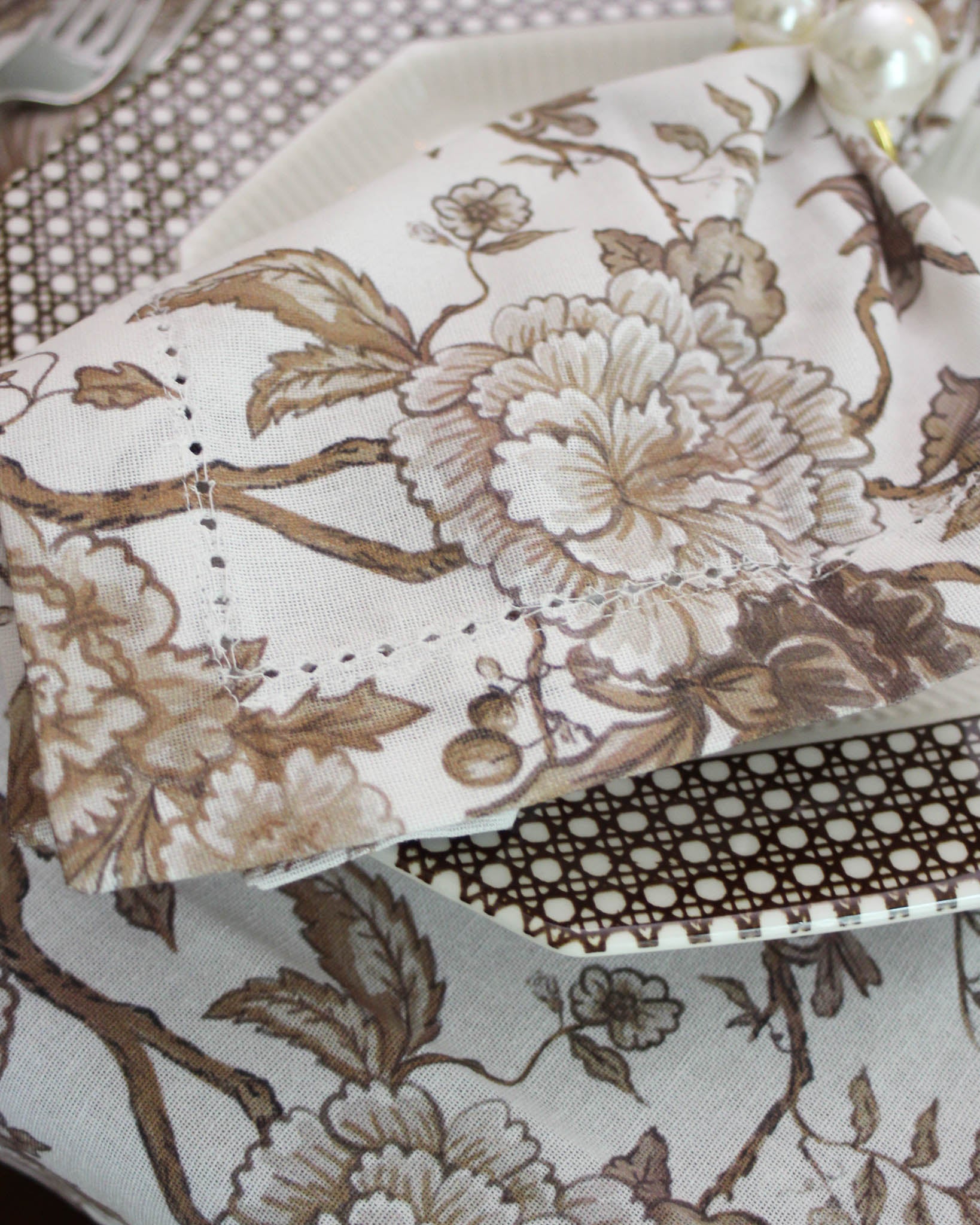 Close-up of hemstitch edge detail on Florence organic cotton napkin in trending chestnut brown color perfect for holiday entertaining and hosting