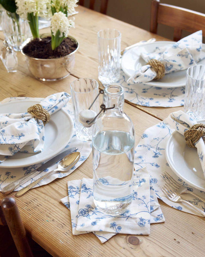 Set of 4 Garden Vine cotton cocktail napkins in a blue and white floral print, perfect for summer hosting, drinks, and Southern living style gatherings.